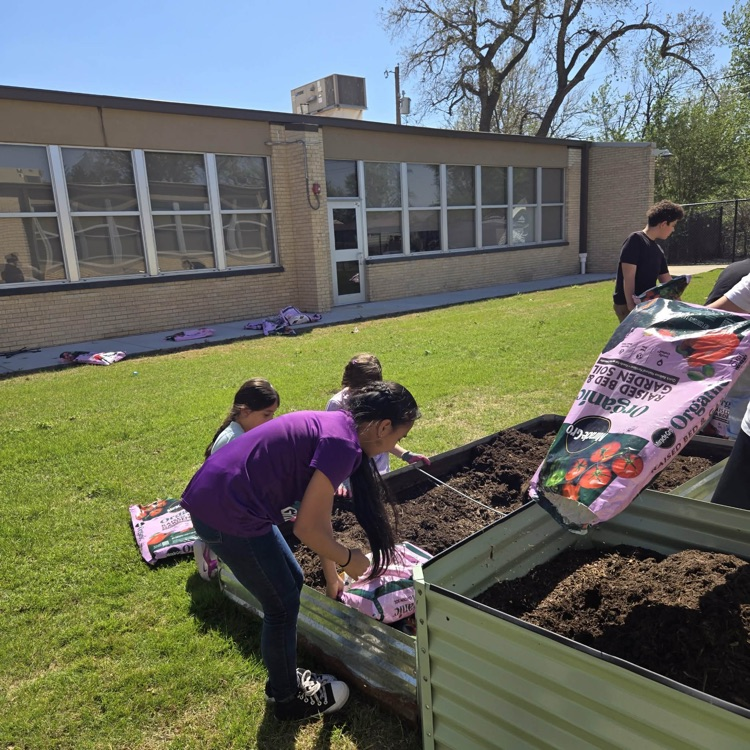 The Monroe Garden Club preps our new garden boxes.💙🦁💛