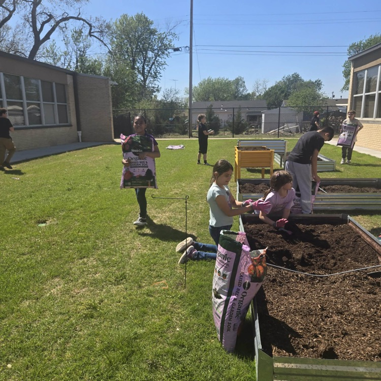 The Monroe Garden Club preps our new garden boxes.💙🦁💛