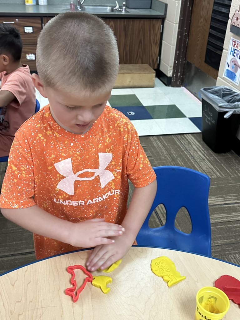 Ms. Silva's class showing off their red shirts for ORANGE day!
