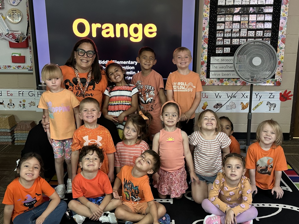 Ms. Silva's class showing off their red shirts for ORANGE day!