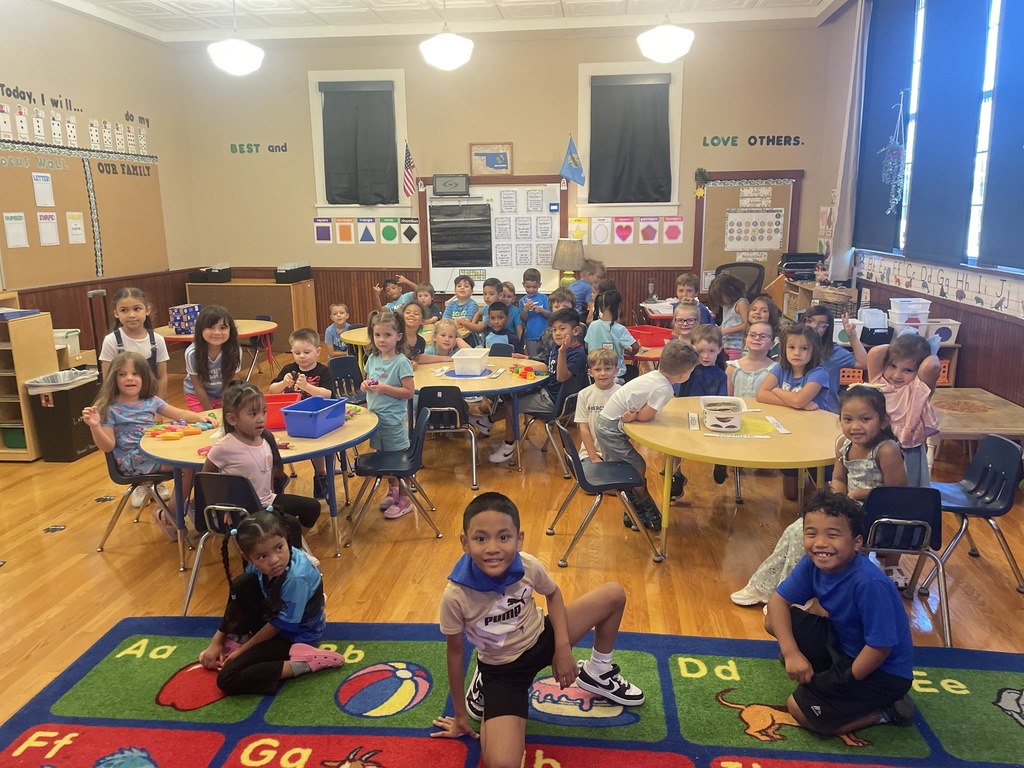 Mrs. Layne's Pre-K class posing with Ms. Day's 2nd grade wearing blue for blue day!