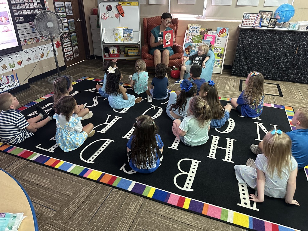 Mrs. Terry reading to Mrs. Silva's pre-k