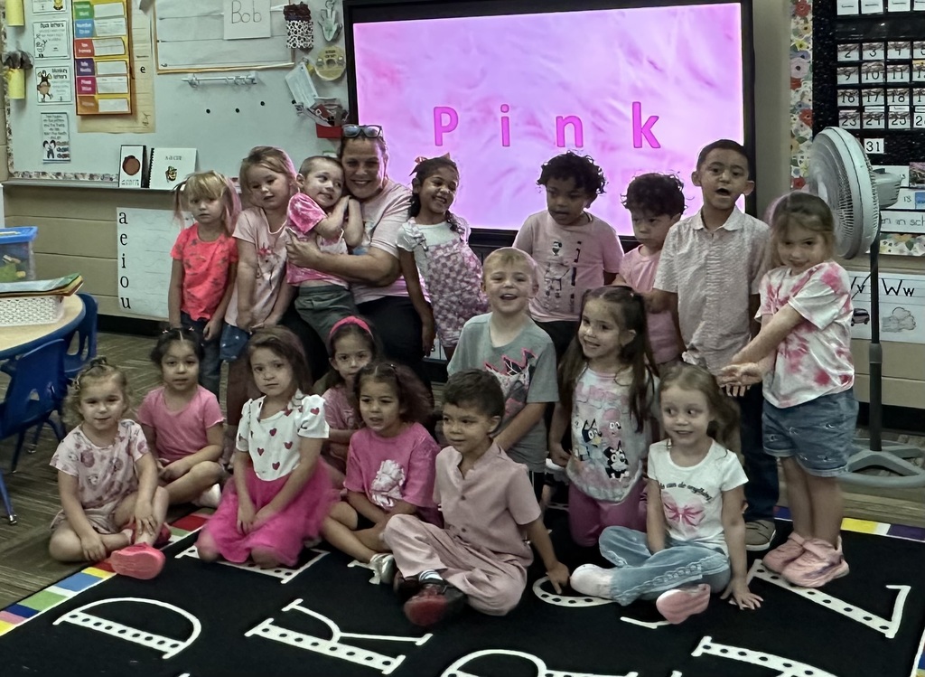 Ms. Silva's class showing off their pink outfits of the day