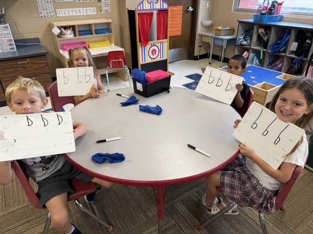Mrs. Sutherland's class showing their drawings of smart cookies
