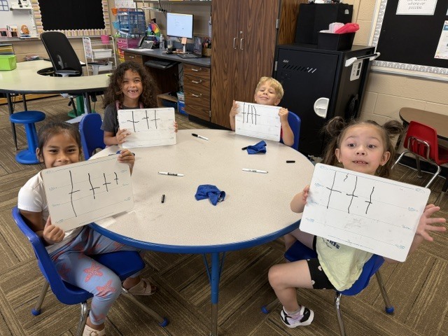 Mrs. Sutherland's class showing their drawings of smart cookies