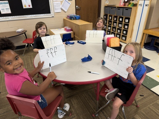 Mrs. Sutherland's class showing their drawings of smart cookies