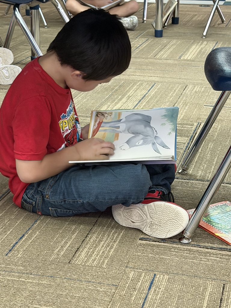 Young man sitting quietly reading