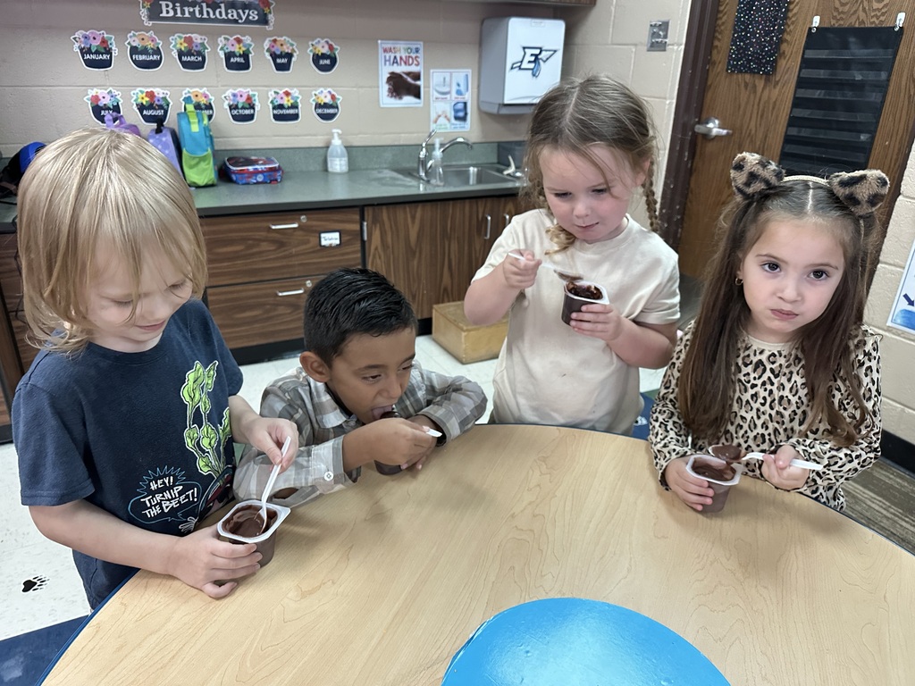 Ms. Silva's class eating chocolate pudding