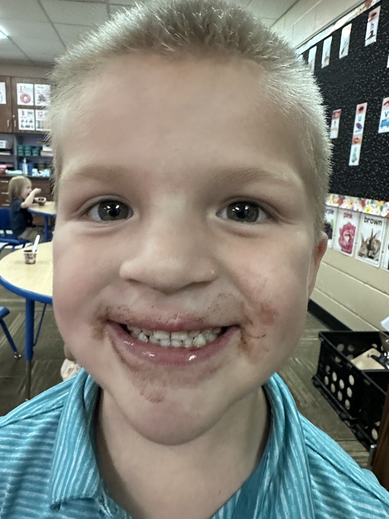 Little boy with chocolate pudding on his face