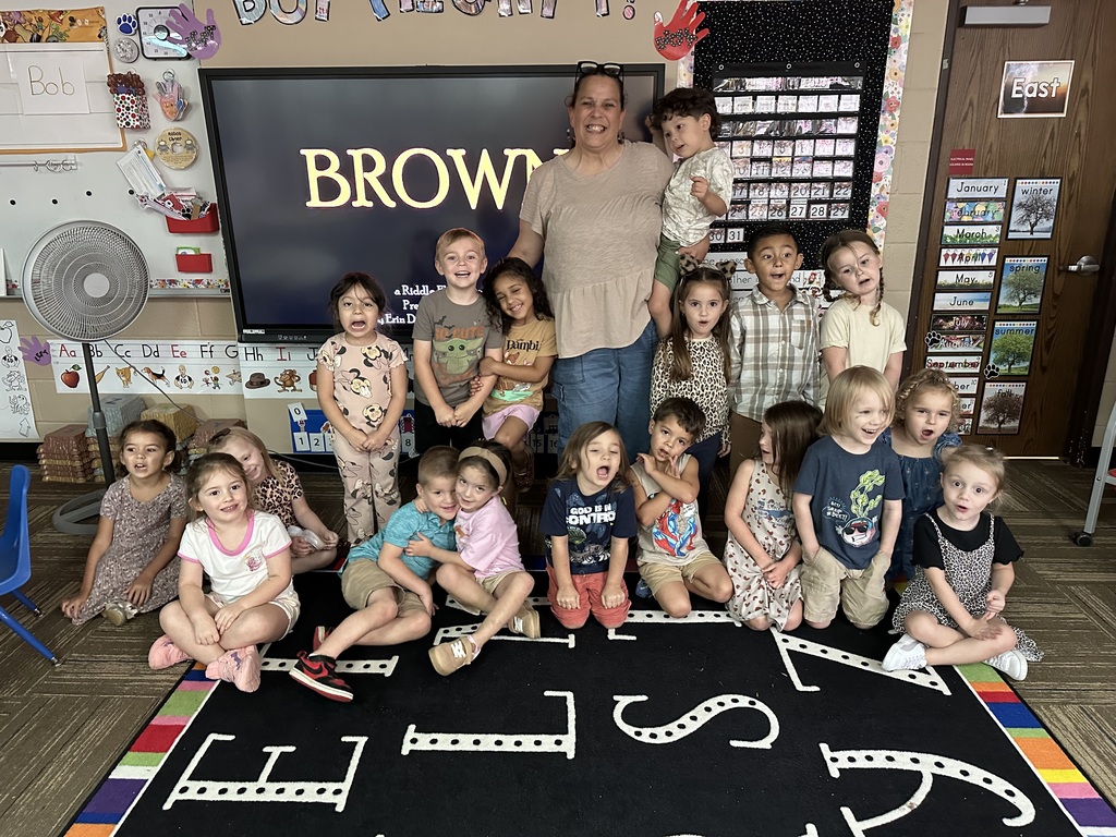 Ms. Silva's class posing in their brown outfits