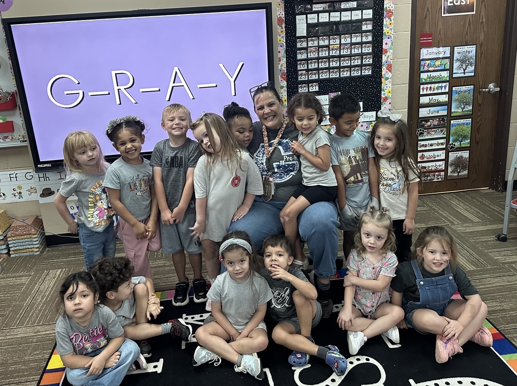 Ms. Silva's class posing in their gray outfits for gray day!