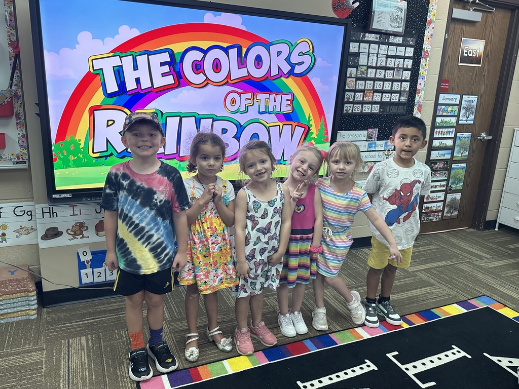 Kids posing in their colorful outfits