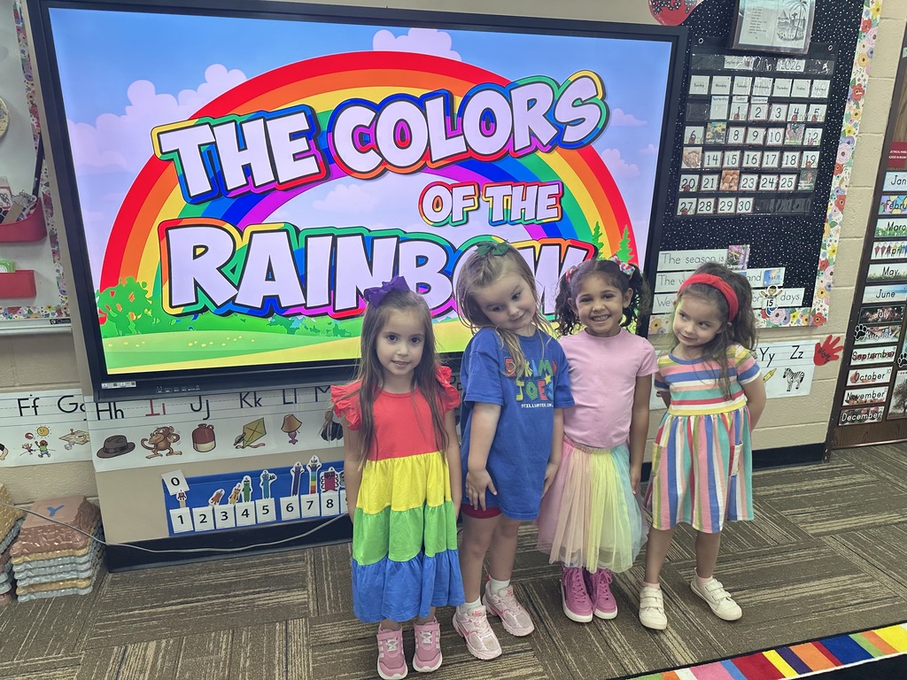Kids posing in their colorful outfits
