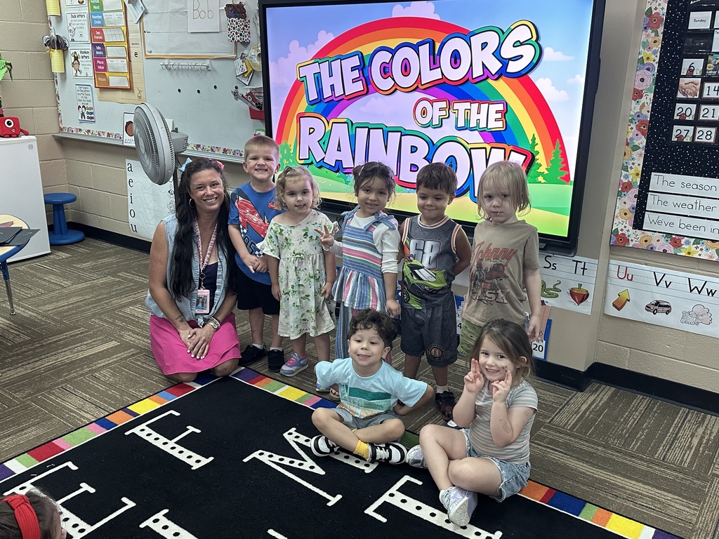 Kids posing in their colorful outfits