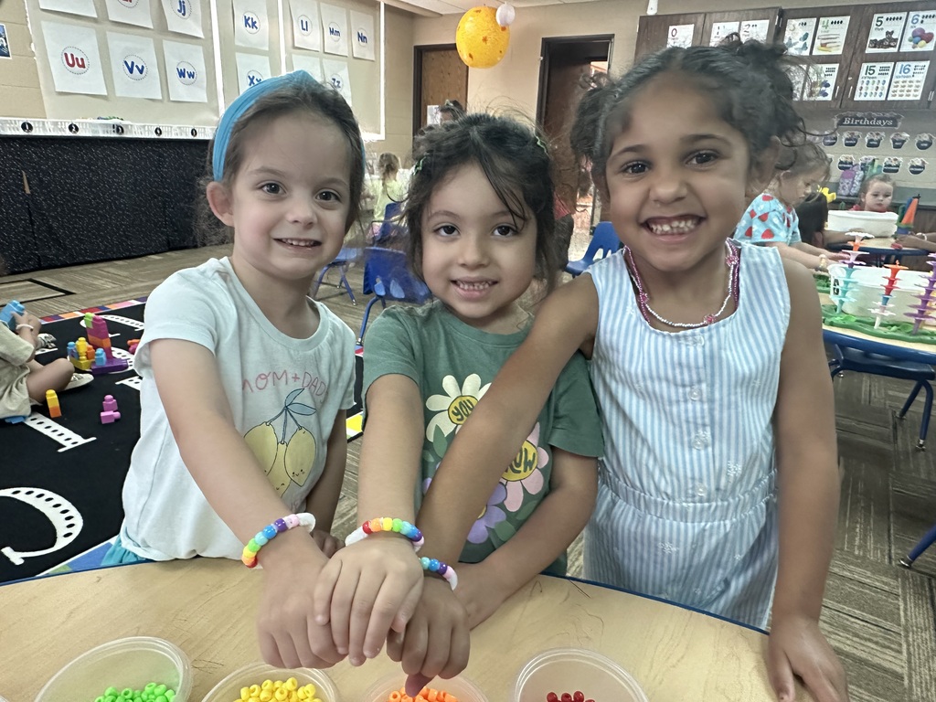 Kids showing their bracelets off together