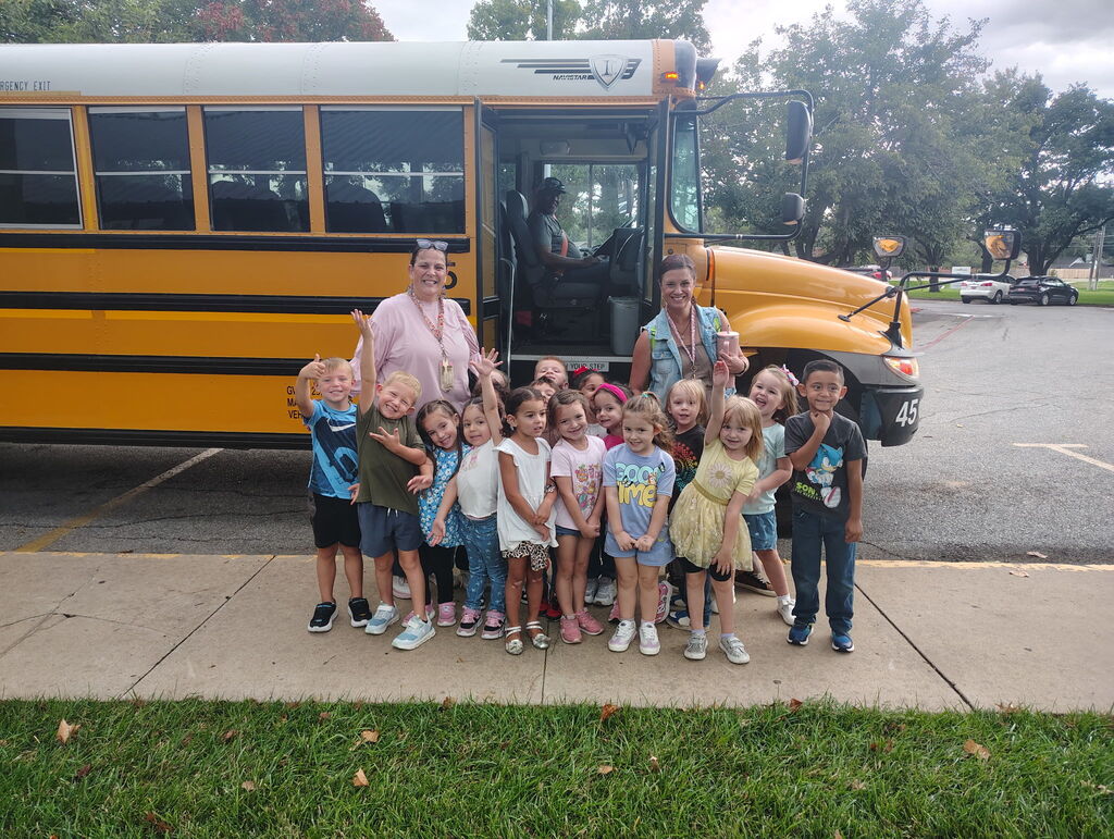 Mrs. Silva's class posing by the bus