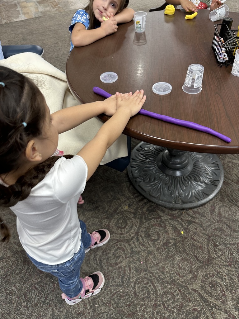 Little girl playing with playdoh