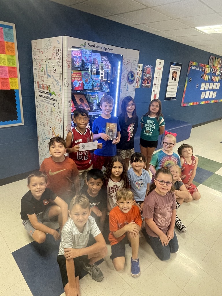 Ms. Day's class in front of the book vending machine