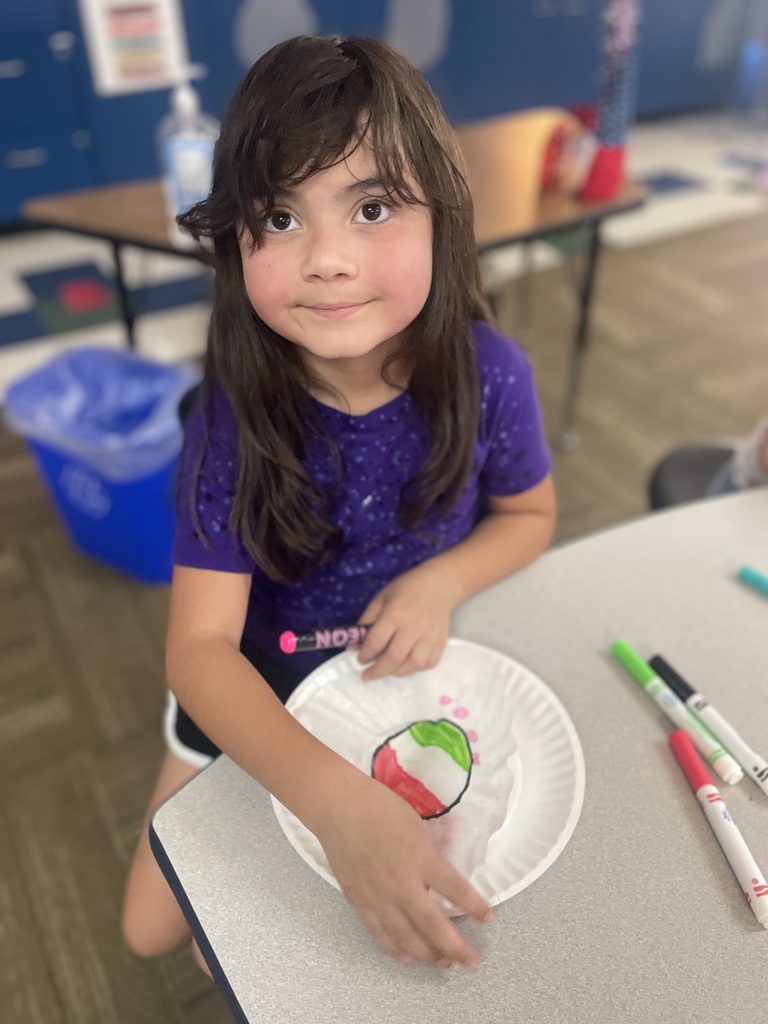 Little girl working on her dot drawing