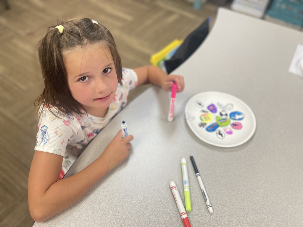 Little girl working on her dot drawing