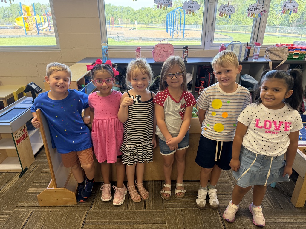 Students posing in their dot outfits