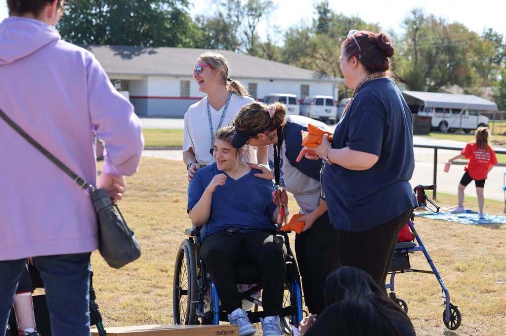 Special Olympics Cornhole - EPS students gather to assist special needs students in playing in a cornhole tournament.