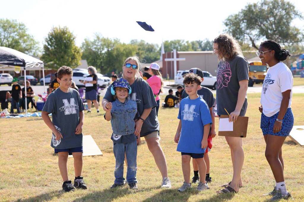 Special Olympics Cornhole - EPS students gather to assist special needs students in playing in a cornhole tournament.