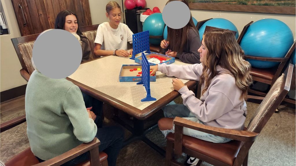 EMS Students playing games with High Point Residents