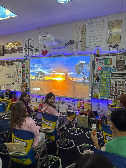 Our students sitting in their seats watching a video of Australia