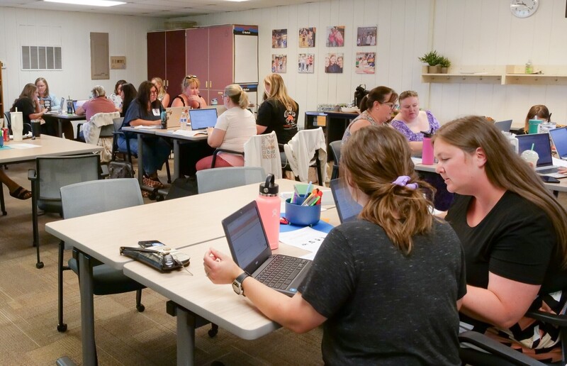 Teachers Laura Lucas and Jen Larimore help develop resources to align assessment and grading across elementary schools.