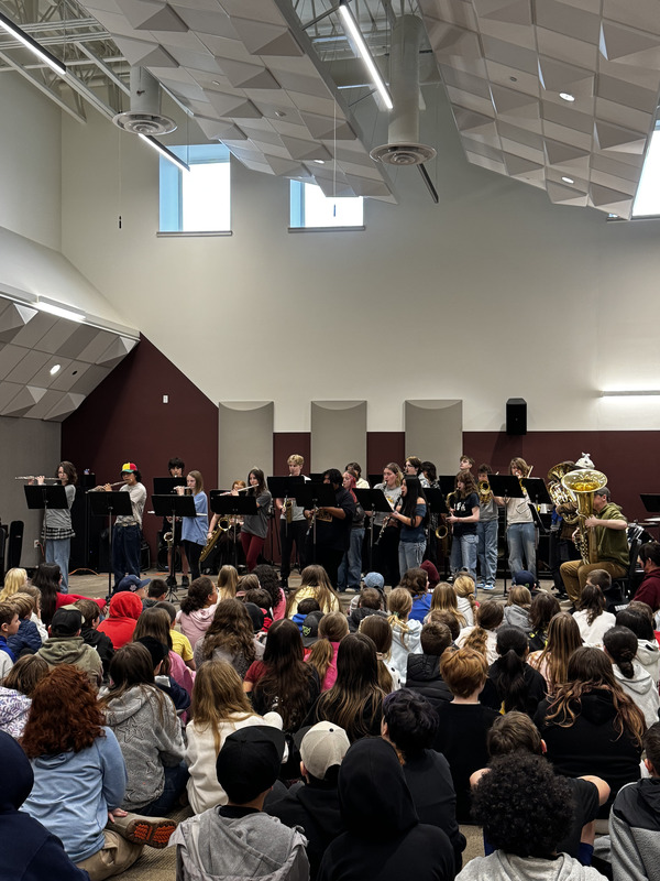 students listen to a band performance