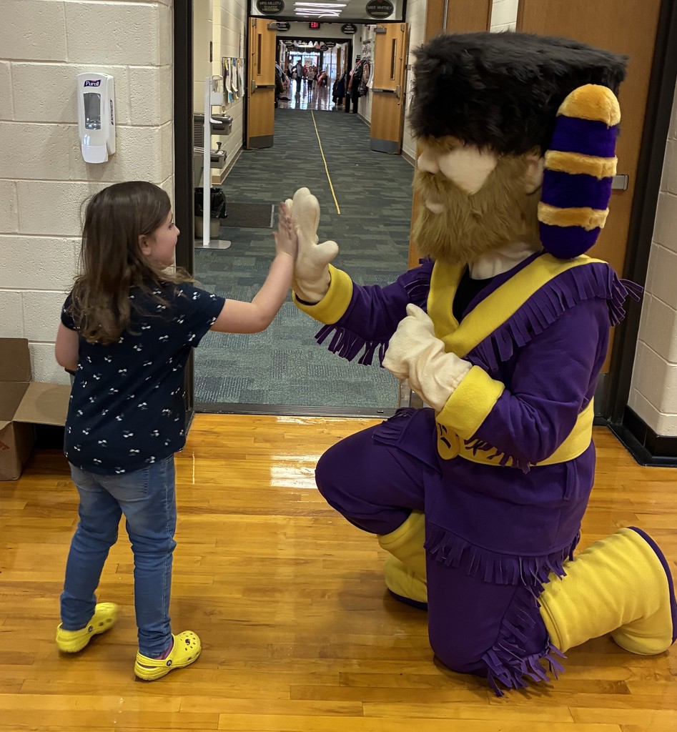 Cliff and student having a high-five