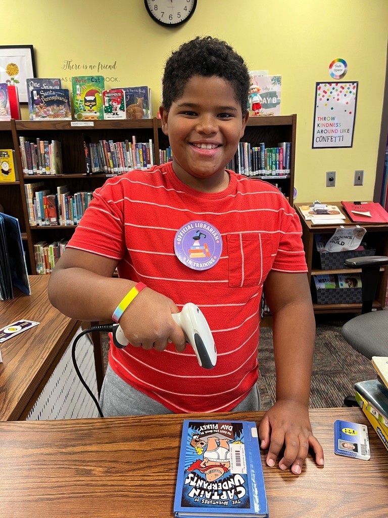 Akron Elementary student scanning a book