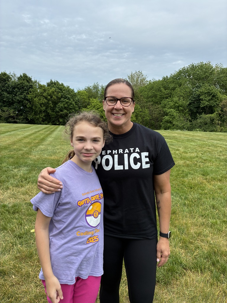 Akron student with police officer