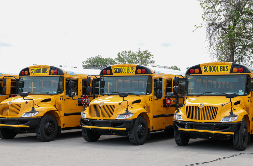 School buses lined up next to each other.