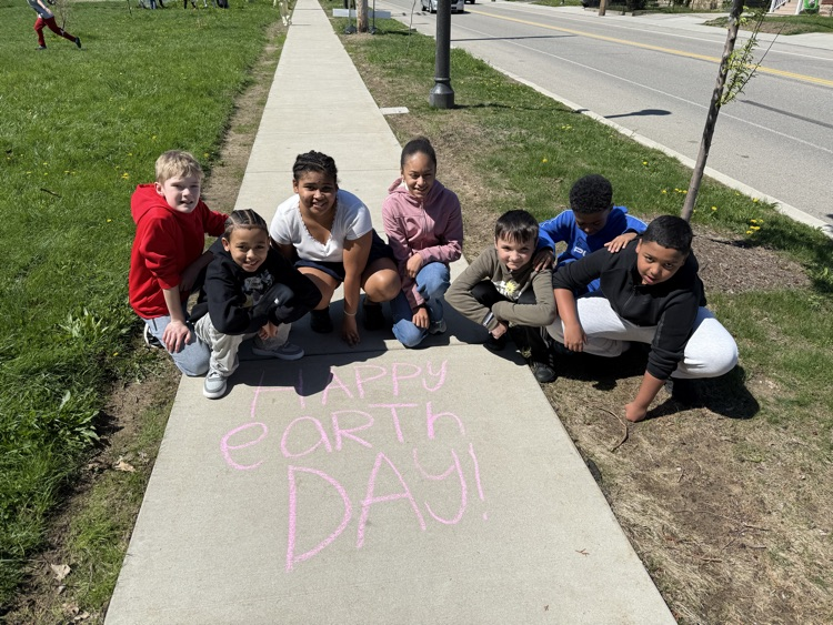 Harding 5th Grade Student Ambassadors cleaning up trash on Earth Day.
