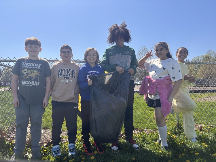 Harding 5th Grade Student Ambassadors cleaning up trash on Earth Day.