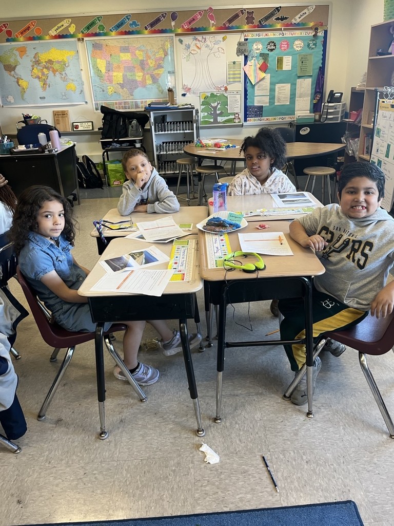 students working together to build their clay models of a national park.