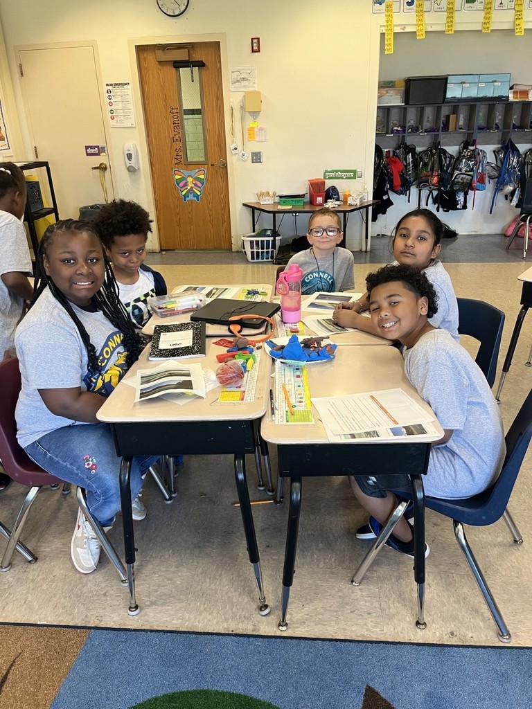 students working together to build their clay models of a national park.