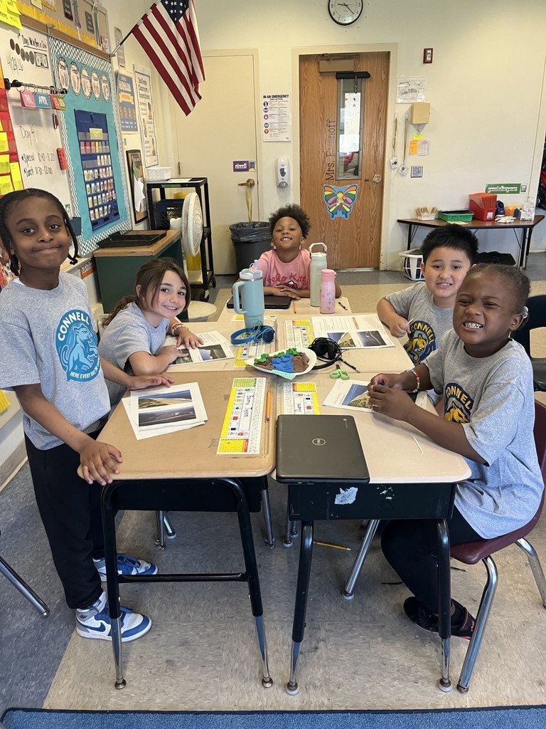 students working together to build their clay models of a national park.