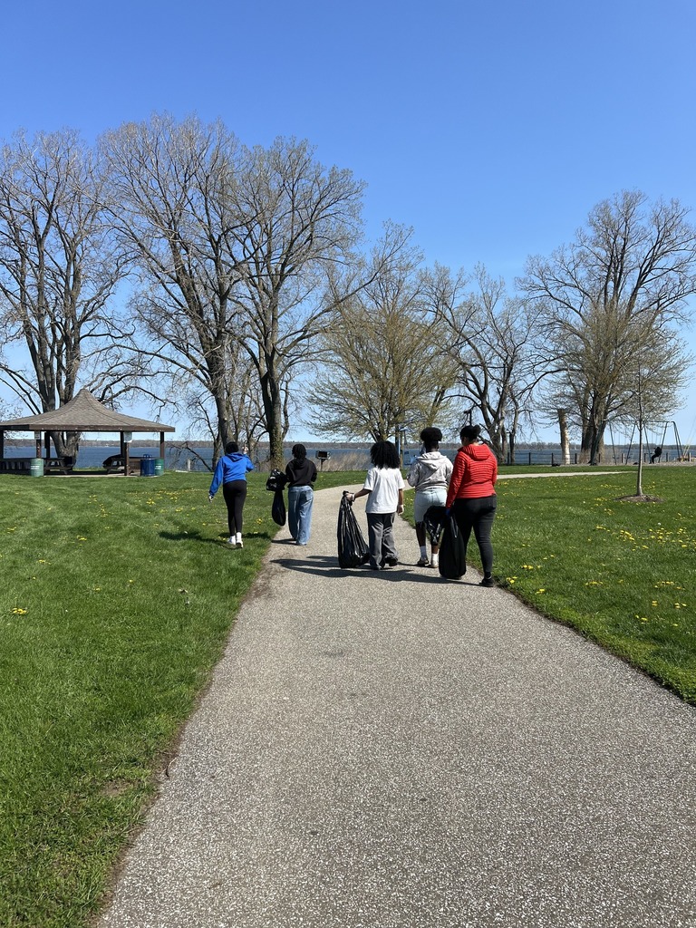 Photo of Erie High students walking through Bayview Park to clean up.