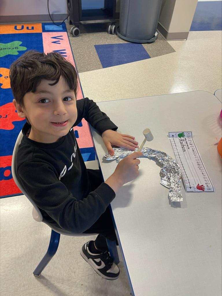 Kindergarten student practicing being a colonial townsperson.