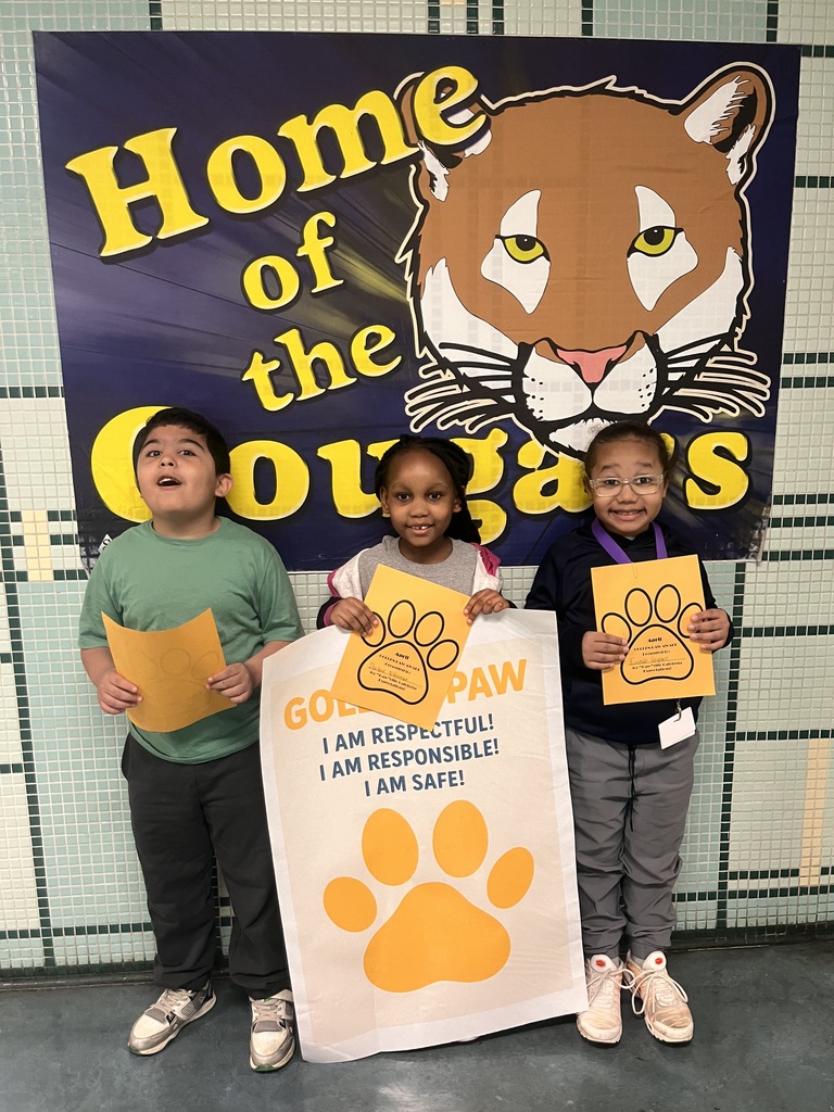 students who got a golden paw award for the month of april are pictured holding their certificates. 