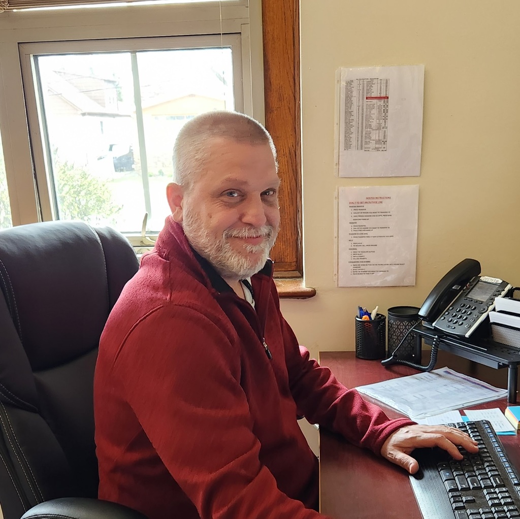 Mr. Munson at his desk.