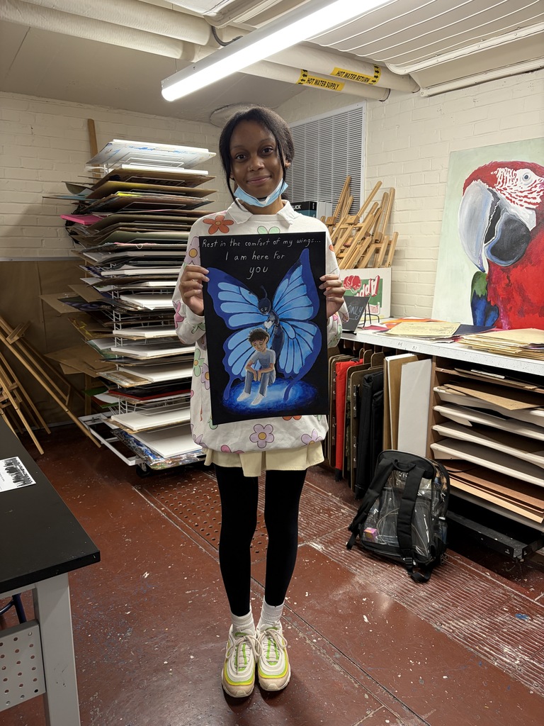 This image is a photograph of Collegiate Academy junior Jada McAllister, whose poster design won the annual Highmark Caring Place Poster Contest.