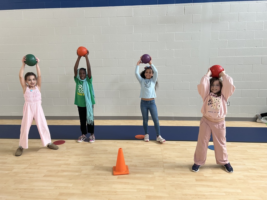 Students in gym class lifting weights.