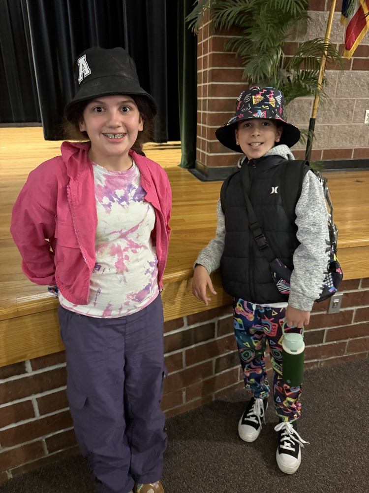 student in 90’s accessories for spirit week 