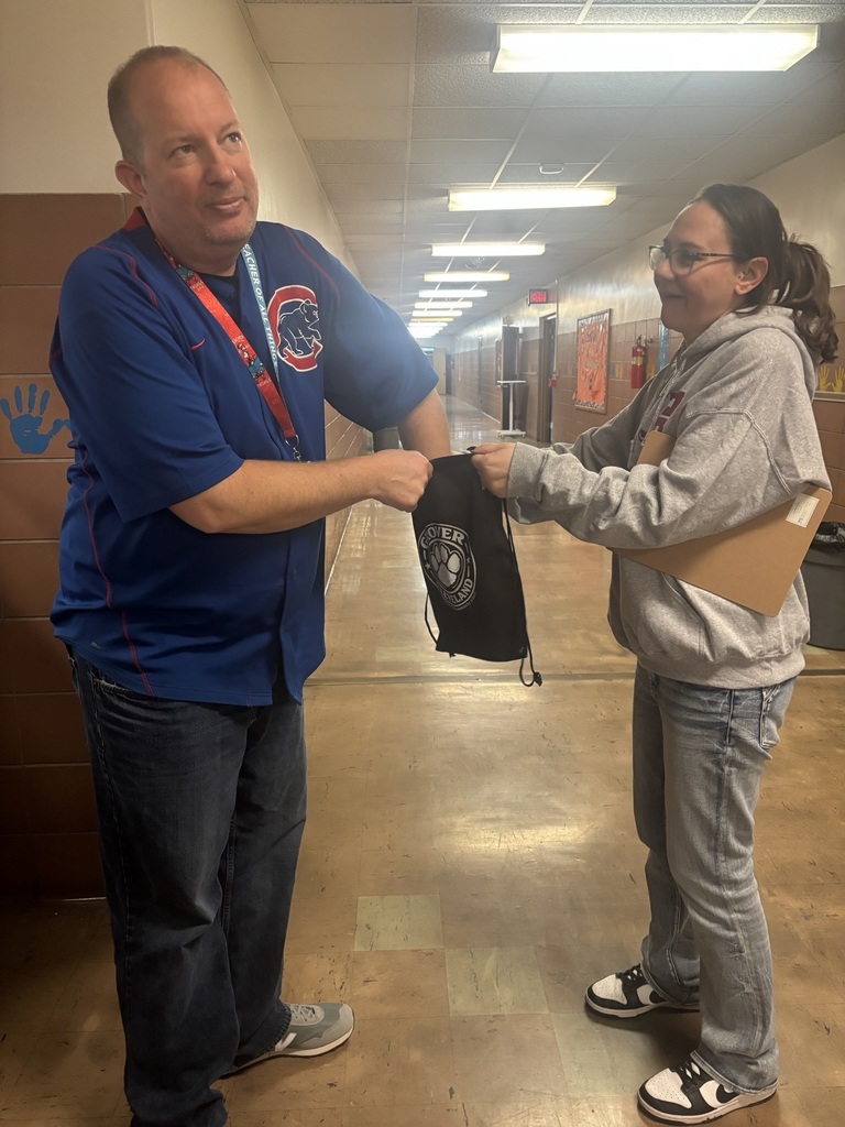 Teacher picking gift card from bag from PTSA