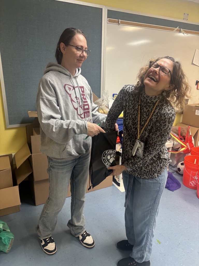 Teacher picking gift card from bag from PTSA