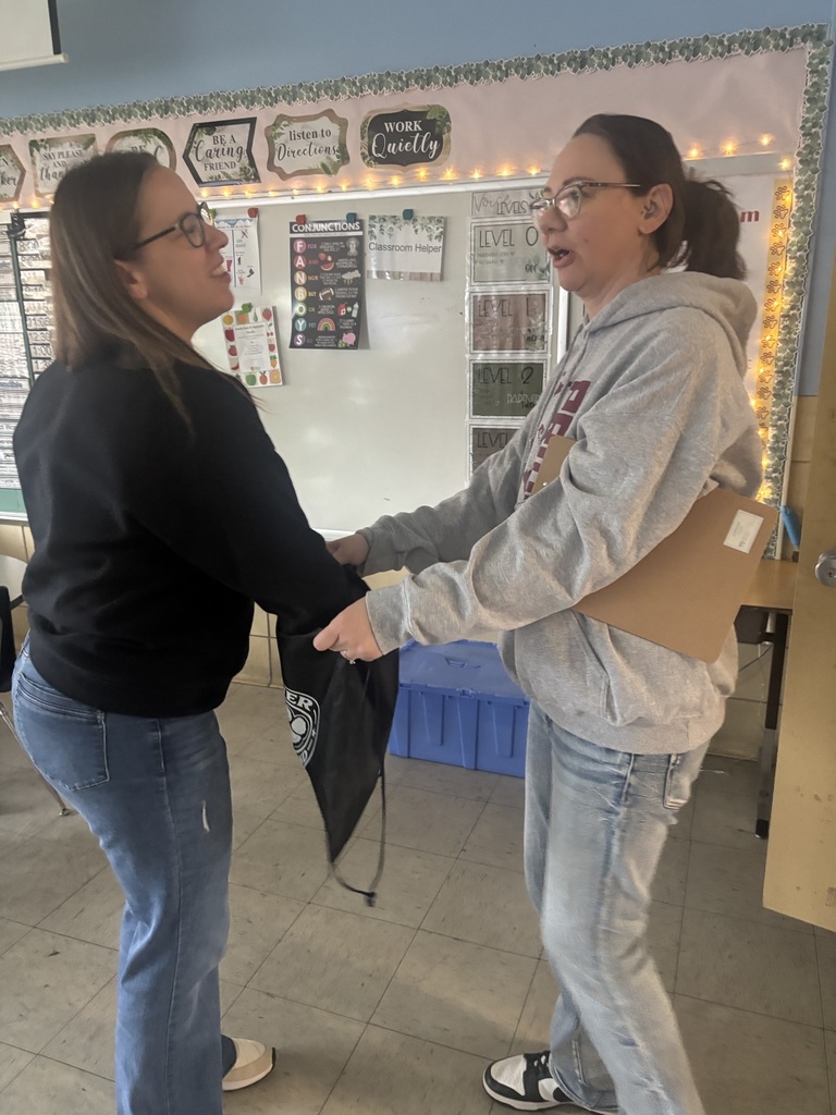 Teacher picking gift card from bag from PTSA